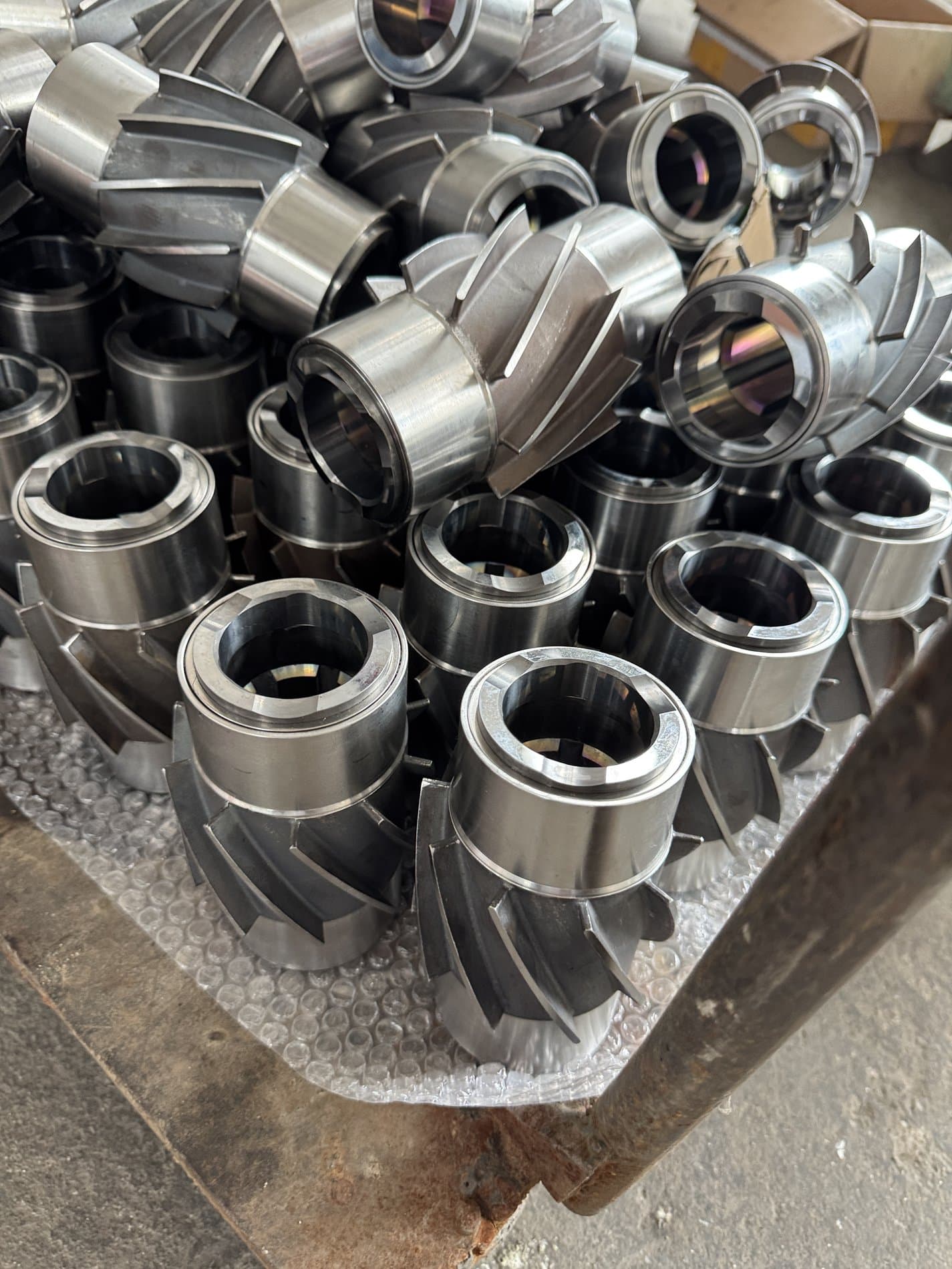 Metal bladed and sleeve components, photographed as supplied
