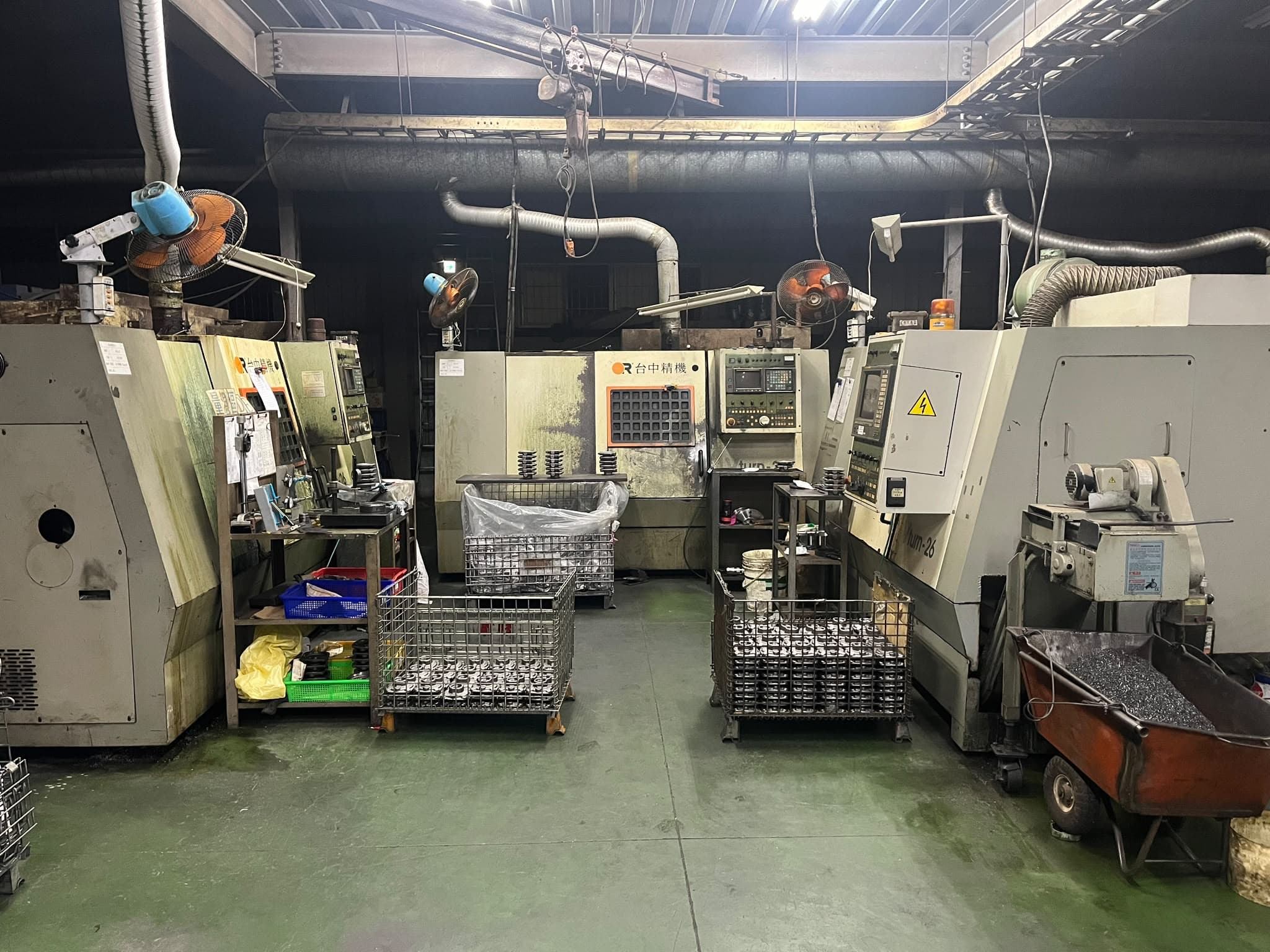 Victor Taichung CNC lathes and parts baskets on the production floor