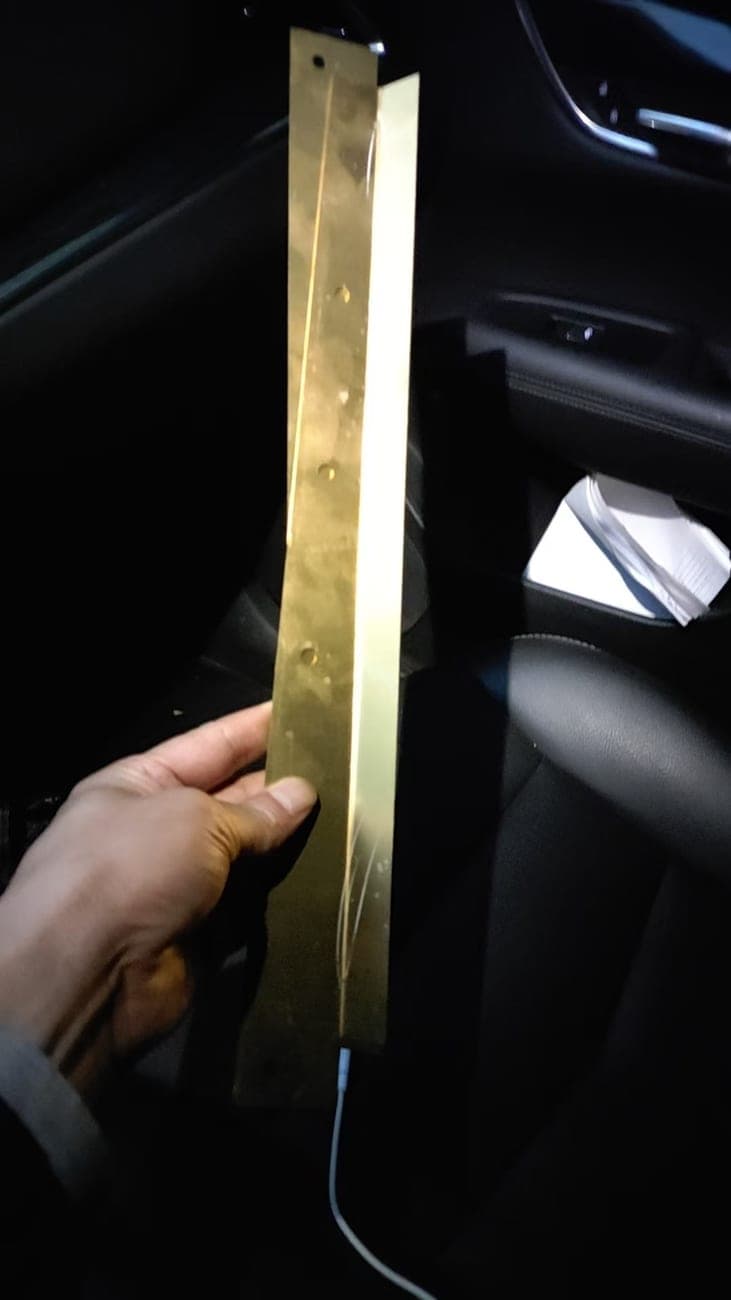 Long folded metal profile with a row of mounting holes